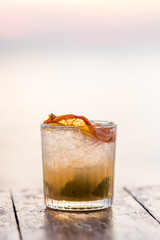 Pina colada cocktail close-up on sunset beach