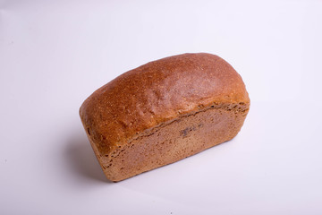 Gray bread on a white background. Baking for food