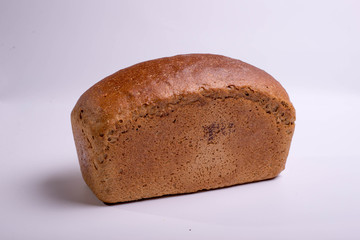 Gray bread on a white background. Baking for food