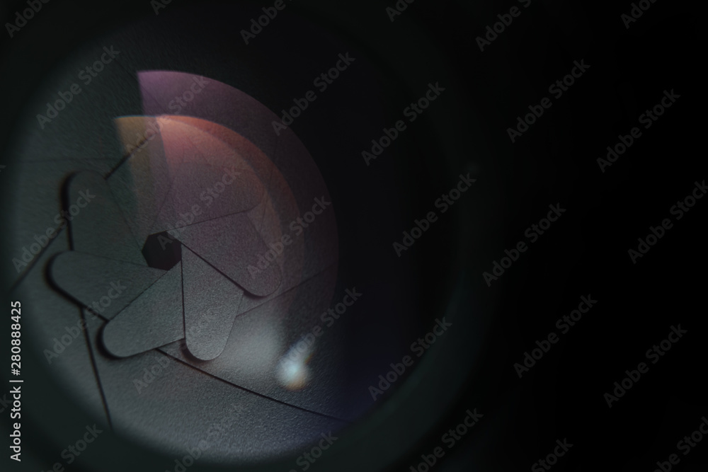 Poster close up beautiful camera lens on a dark background. macro view.