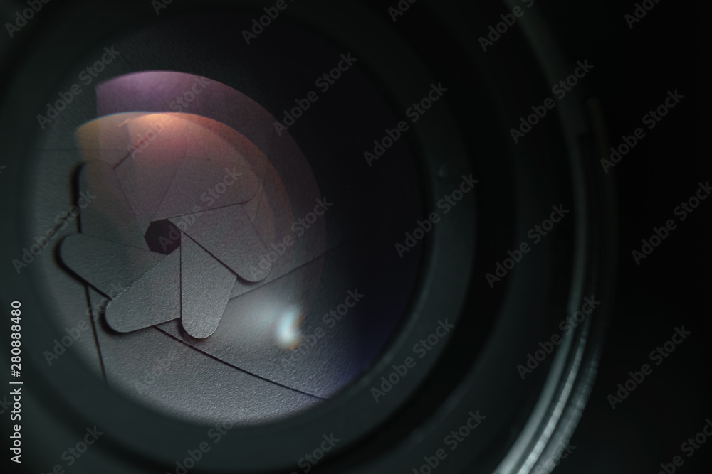 Poster close up beautiful camera lens on a dark background. macro view.