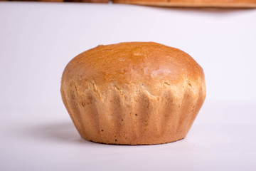 Beautiful white bread on a white background. Round baking