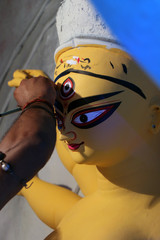 Idol of Hindu Goddess Durga during preparations in Kolkata. Clay idol of Goddess Durga, under preparation for Bengal's Durga Puja festival at Kumartuli Kolkata. Durga Puja is biggest festival in India