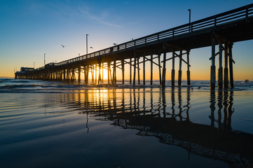 Fototapeta na wymiar newport beach pier at sunset