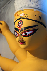 Idol of Hindu Goddess Durga during preparations in Kolkata. Clay idol of Goddess Durga, under preparation for Bengal's Durga Puja festival at Kumartuli Kolkata. Durga Puja is biggest festival in India