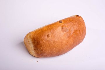 A loaf of bread on a white background. Baked delicious bread isolated