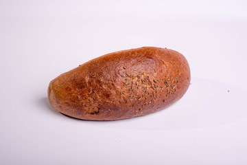 Gray bread on a white background. Insulated Baking Loaf