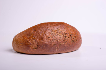 Gray bread on a white background. Insulated Baking Loaf