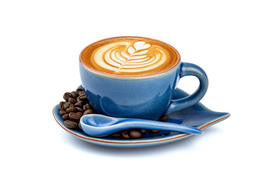 Side view of hot latte coffee with latte art in a ceramic blue cup and saucer isolated on white background with clipping path inside. Image Stacking Techniques.
