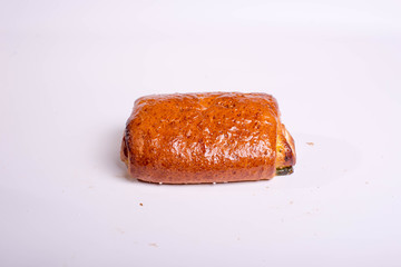 Small roll with poppy seeds. Snack for lunch. Dessert pastries on a white background