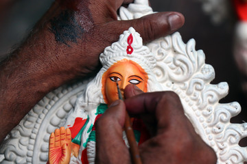 Idol of Hindu Goddess Lakshmi during preparations in Kolkata. Clay idol of Goddess Lakshmi, under...