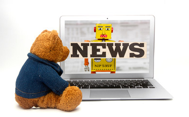 tedy is watching the fake news on a laptop
