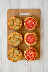 Cooking cheeseburger step-by-step, view from above. Overhead, top view, overhead. Close-up.