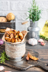 Baked young potatoes in a rustic style with sour cream