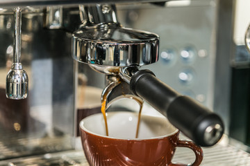 Coffee with various options.Espresso machine making coffee in cup. Brewing coffee with espresso machine