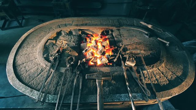 Blacksmithing tools on an anvil.
