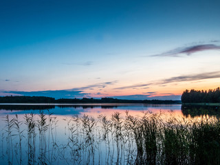 Sunset on the shores of the calm Saimaa lake in the Linnansaari National Park in Finland - 6