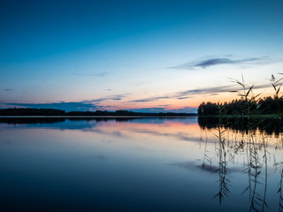 Sunset on the shores of the calm Saimaa lake in the Linnansaari National Park in Finland - 8