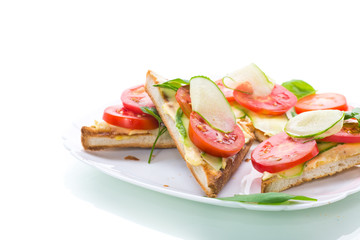 tasty sandwich with curd paste, fresh cucumbers and tomatoes