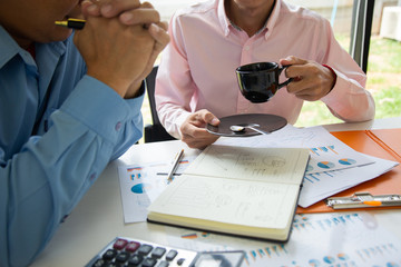 Businessman team is analyzing the cost of housing projects to live with lifestyle.business concept, soft focus, vintage tone