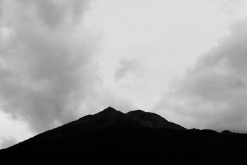 Mountain peak hidden by clouds