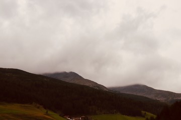 Mountain peak hidden by clouds