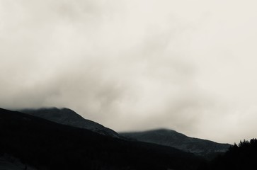 Obraz na płótnie Canvas Mountain peak hidden by clouds