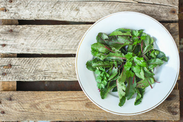 Healthy salad, leaves mix salad (fresh green juicy snack). food background. top