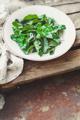 Healthy salad, leaves mix salad (fresh green juicy snack). food background. top
