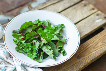 Healthy salad, leaves mix salad (fresh green juicy snack). food background. top