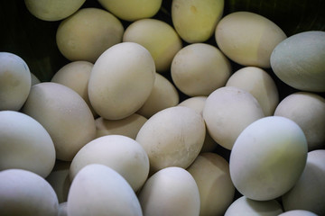 background of fresh eggs for sale at a market. Group of organic free range chicken eggs