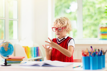 Kids doing homework. Children go back to school.