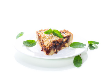 sweet cake with fruit jam in a plate on a white
