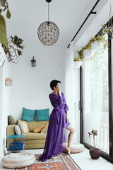female with short haircut poses in Tbilisi loft