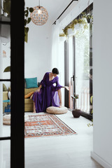 female with short haircut poses in Tbilisi loft