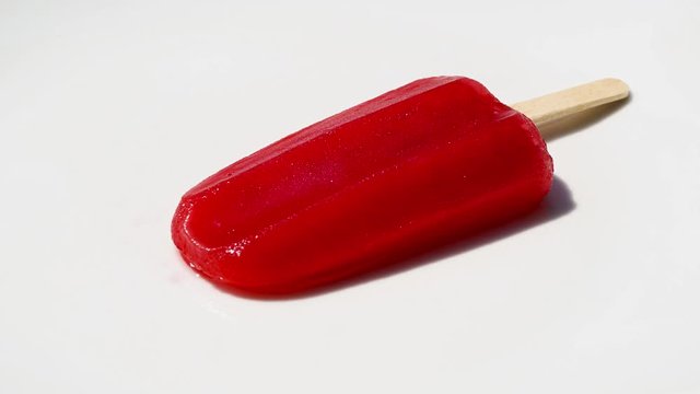 Red popsicle melting time lapse