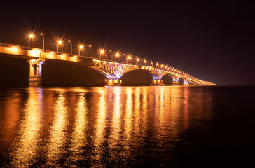 Summer Night on Volga river, golden light bridge