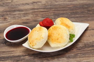 Curd pancakes with jam and stravberry