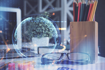 Map hologram with glasses on the table background. Concept of globalization. Double exposure.