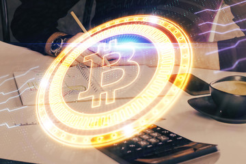 Man's hands working with notes background. Cryptocurrency and finance concept.