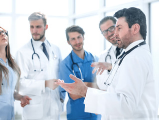 group of medical staff is discussing in the corridor of the clinic