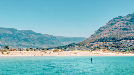 Paddleboarding off the coast of Hout Bay Beach in Cape Town.