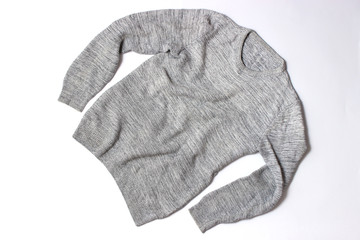 Sweater on a white background top view.