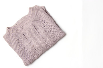 Sweater on a white background top view.