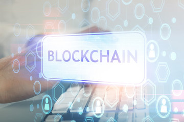 Crypto currency theme hologram with businessman working on computer on background. Concept of...