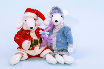 Cute white rats in a suit of Santa Claus and Snow Maiden on a blue background with ribbons. Symbol of 2020 on the eastern calendar.lendar. Copy space