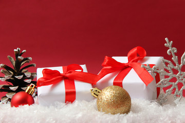 Christmas balls and snow on a colored background. Christmas and New Year background.