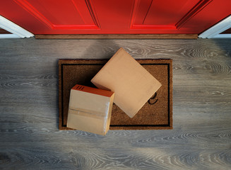 Delivered to the door, e-commerce purchases on welcome mat. Add your own labels