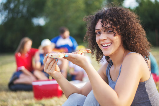 Friends Eating Pizza Outside