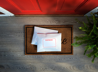 Express service envelopes delivered to door step. Overhead view. Copy space